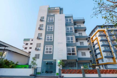 a building with writing on the side of it at Treebo The Tree, Hinjewadi in Pune