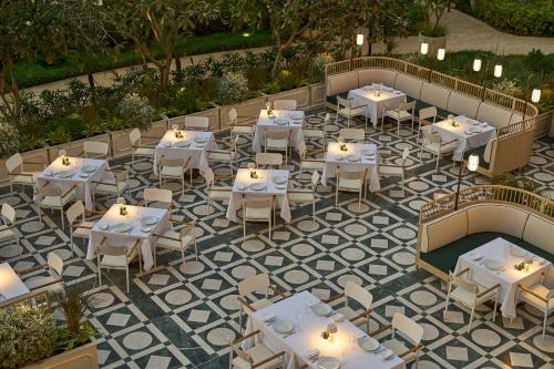 an overhead view of a restaurant with white tables and chairs at Four Seasons Resort Dubai at Jumeirah Beach in Dubai