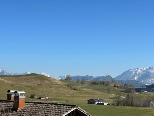 a view of a hill with mountains in the background at Haus Edelweiss Panorama incl, Königscard in Nesselwang