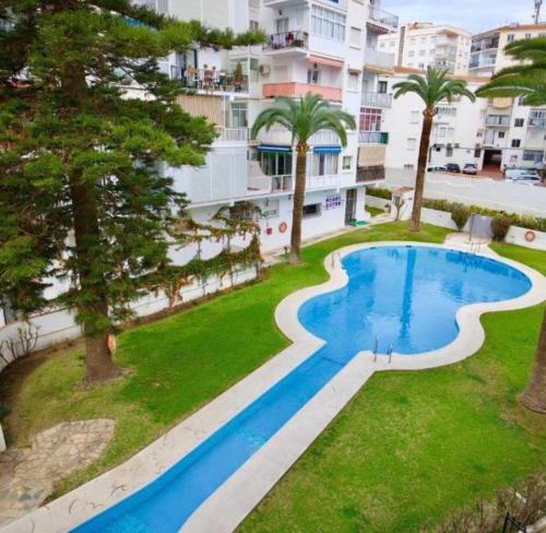 an image of a swimming pool at a resort at Apartamento Brisa Mar de Nerja in Nerja