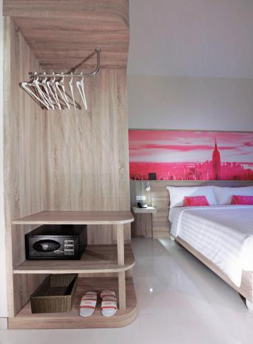 Ένα ή περισσότερα κρεβάτια σε δωμάτιο στο fave plus hotel Banjarbaru