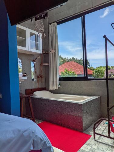 Ένα ή περισσότερα κρεβάτια σε δωμάτιο στο Ceria House Ungasan Uluwatu