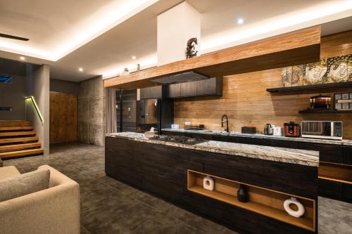 a kitchen with a large counter in a room at Villa Zilla by BaliSuperHost in Tegalalang
