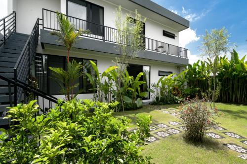 a house with a garden in front of it at Villa Zilla by BaliSuperHost in Tegalalang