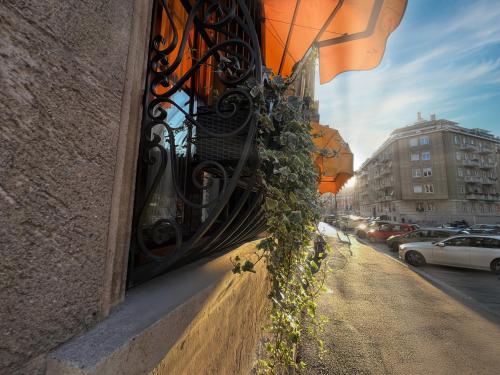 a building with a window with plants on it at Mercadante Suite Central City in Milan