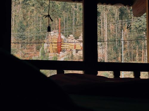 a room with a window looking out at a zoo at Mơ Homestay in Dồng Văn