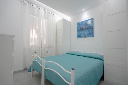 Ένα ή περισσότερα κρεβάτια σε δωμάτιο στο Aurora del Mare