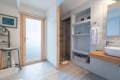 a bathroom with a sink and a mirror at Casa La Roca in Pollença