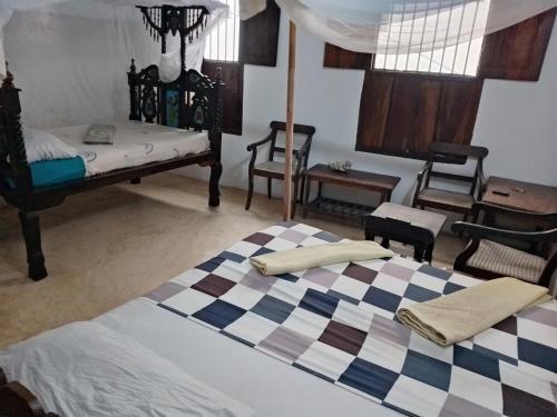 Postel nebo postele na pokoji v ubytování Ajooba