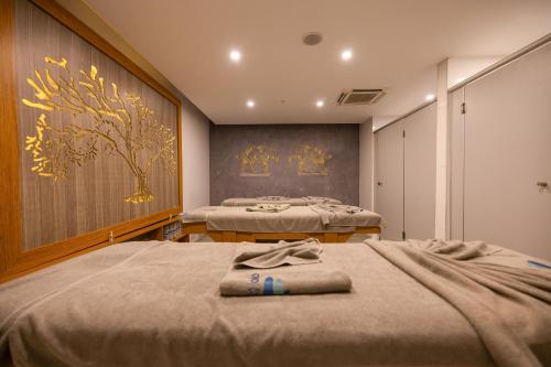 Katil atau katil-katil dalam bilik di INFINITY BY YELKEN AQUAPARK&RESORTS KUŞADASI