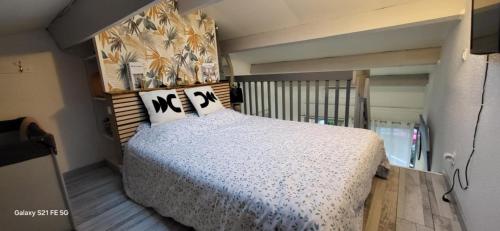 En eller flere senge i et værelse på Appartement T2 Ensoleillé au Barcarès