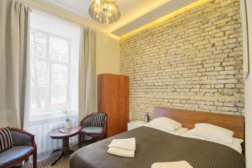 Postel nebo postele na pokoji v ubytování Taurus Apartments Vilnius