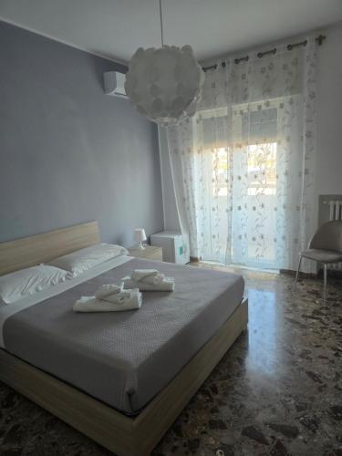 a bedroom with a bed with two towels on it at Ponte sul mare in Bari