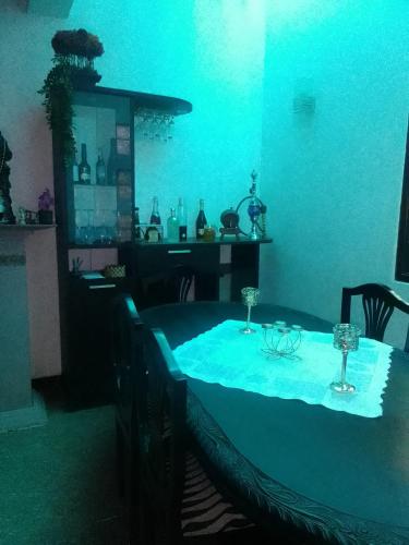a dining room with a table with glasses on it at D Villa 1 in Katunayaka