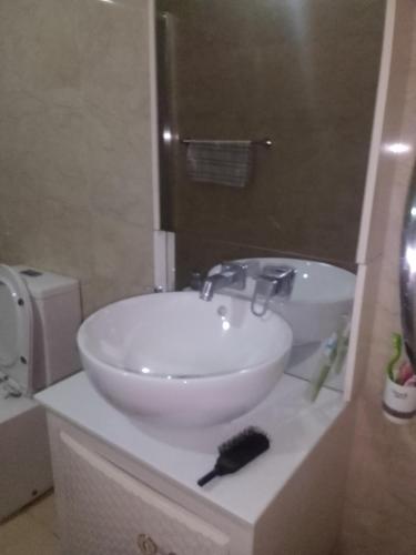 a white sink sitting on top of a counter in a bathroom at D Villa 1 in Katunayaka