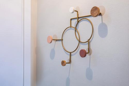 a pair of glasses hanging on a wall at LaMalatestina Suite - Apartment in front of the Castle in Rimini