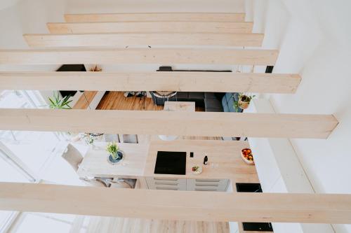 an overhead view of a room with wooden stairs at Ubytování Ve dvorku in Uherčice