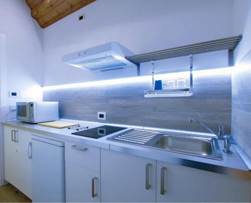 Kuchyň nebo kuchyňský kout v ubytování Alkimia Smart Rooms