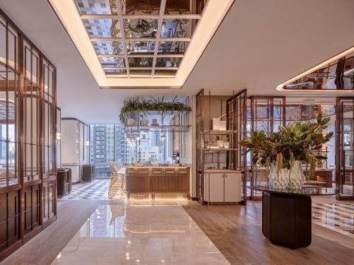 a large room with a ceiling with windows at InterContinental Bangkok Sukhumvit by IHG in Bangkok
