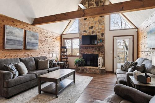a living room with a stone wall at Lakelife at Somerset home in Somerset