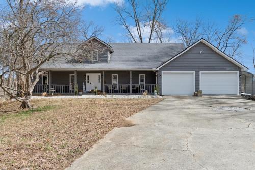 a large house with a driveway in front of it at Lakelife at Somerset home in Somerset