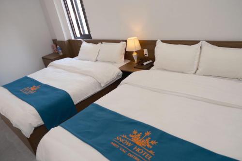 Katil atau katil-katil dalam bilik di Snow Hotel