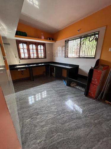 an empty room with a ping pong table in it at HostelVK Gokarna in Gokarna