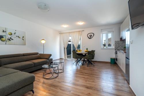 a living room with a couch and a table at Argola in Trogir