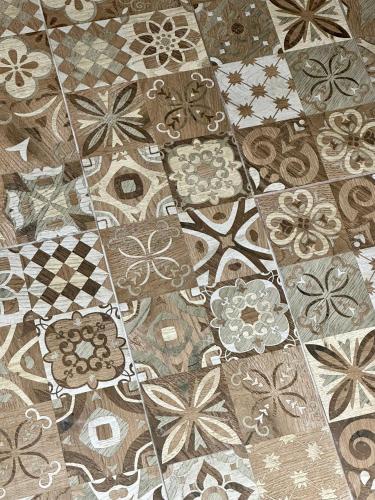 a close up of a quilt with flowers on it at Midgard Suites (Medieval Town) in Rhodes Town