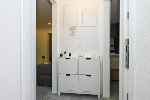 a white cabinet in a room with a wall at Luxury Villas Travera in Novalja