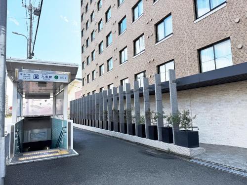 an empty street in front of a building at Sakura Terrace in Kyoto