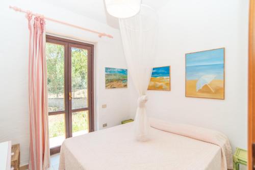 A bed or beds in a room at Villa Calipso