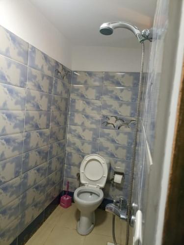 a bathroom with a toilet and a shower at Chillax Dahab in Dahab