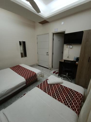 Katil atau katil-katil dalam bilik di The Asteria Hotel Bogura