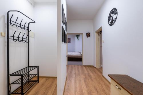 a room with a staircase and a room with a bed at Apartmán v Poleradech in Polerady
