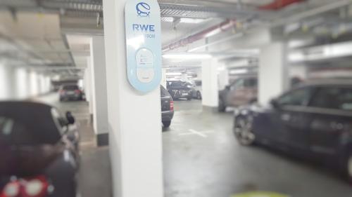a parking garage with cars parked in it at Park Inn by Radisson Frankfurt Airport in Frankfurt/Main
