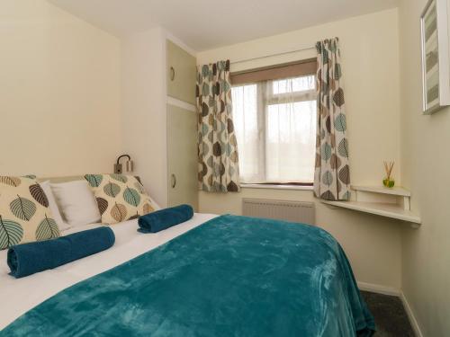 Postel nebo postele na pokoji v ubytování Kenegie Cottage