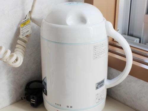 a white mixer sitting on top of a counter at Hotel Trend Asahikawa in Asahikawa