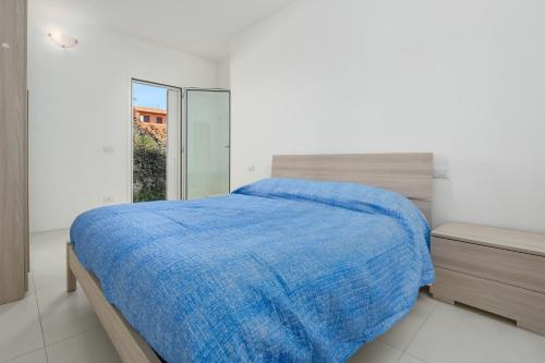 Postel nebo postele na pokoji v ubytování Cormorani - Appartamento 7
