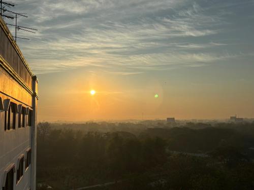 a view of the sunset from a building at Royal Mekong Riverside Hotel in Nong Khai