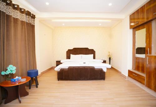 Ένα ή περισσότερα κρεβάτια σε δωμάτιο στο Hunza Elites hotel