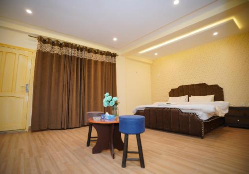Ένα ή περισσότερα κρεβάτια σε δωμάτιο στο Hunza Elites hotel
