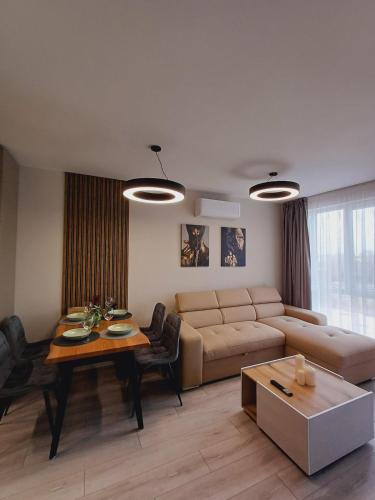 a living room with a couch and a table at Your Home in Plovdiv with Free Private Parking in Plovdiv