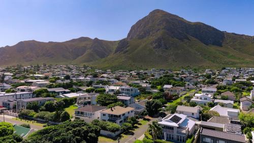 an aerial view of a city with mountains in the background at The Mountainview Family Retreat in Hermanus