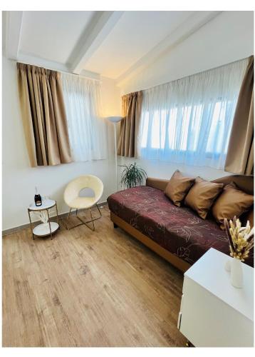 a living room with a bed and a table at Hotel La Torraccia in Tarquinia