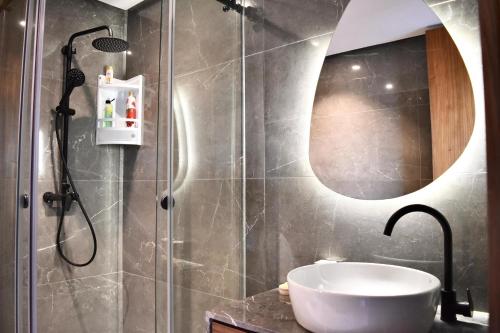 a bathroom with a sink and a shower at Le Palmier - By Mi-Haven in Casablanca