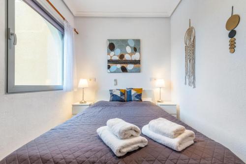 Postel nebo postele na pokoji v ubytování 059 Bungalow Torrelamata