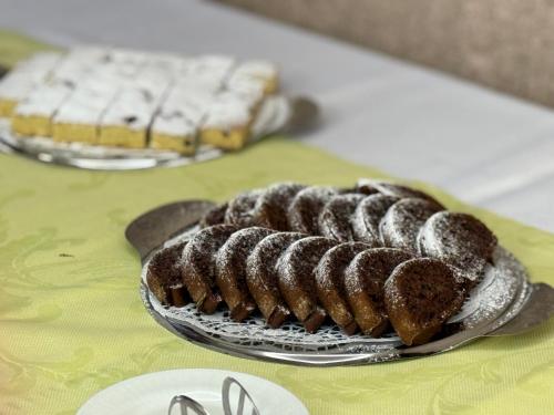 a group of donuts on a plate on a table at Wellness Hotel Diplomat in Rajecké Teplice