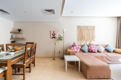 a living room with a couch and a table at El Gouna - BIRD NEST in Hurghada