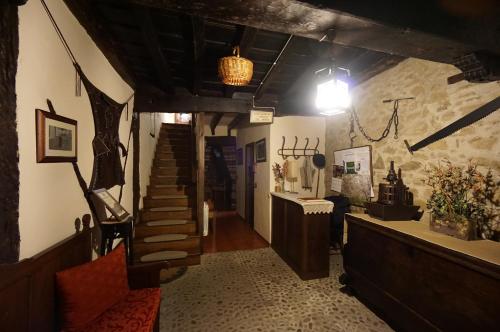 a hallway with a staircase in a building at Apartamentos Rurales Tía Josefa in Tornavacas